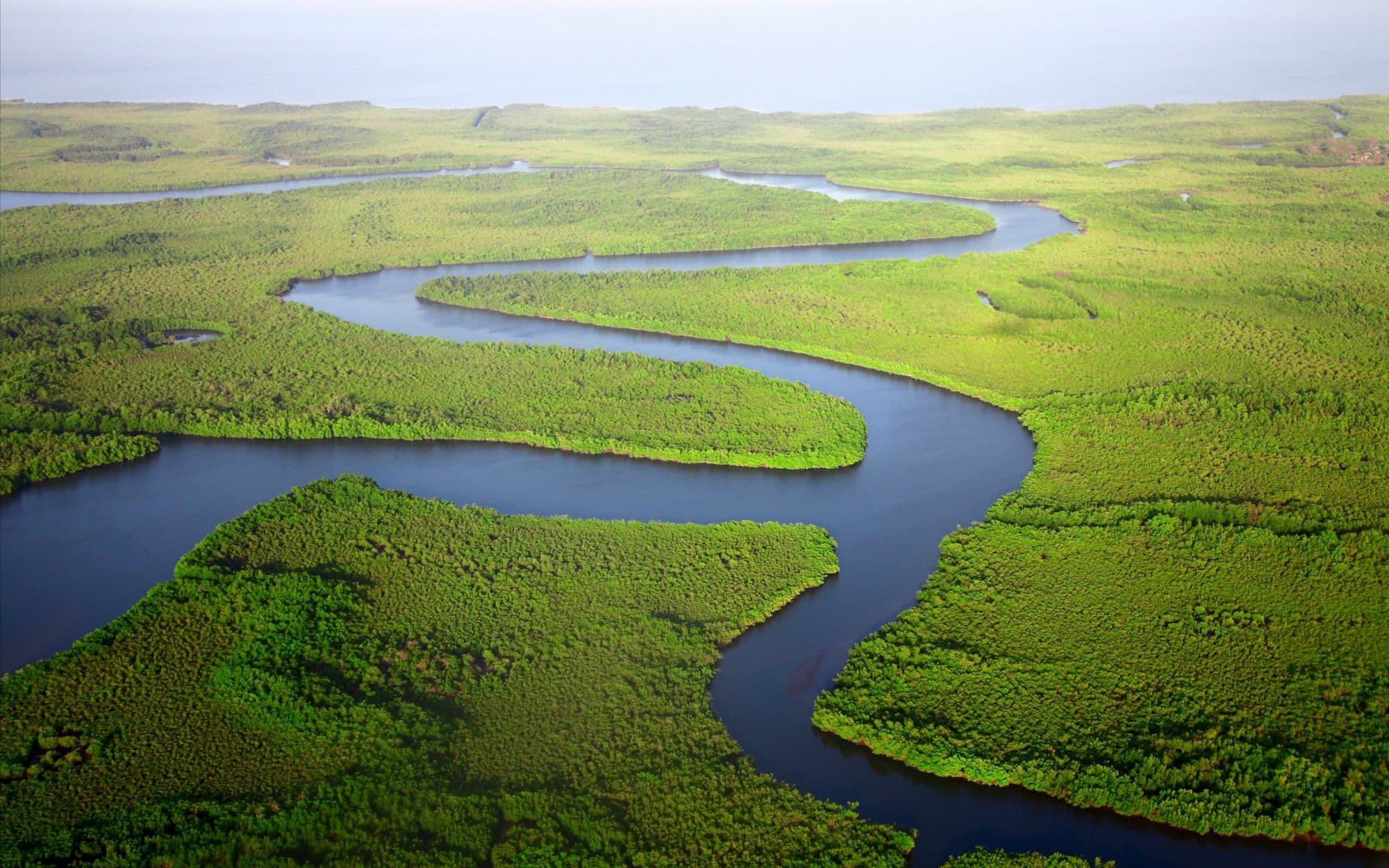 A river winding in loops through a green valley
