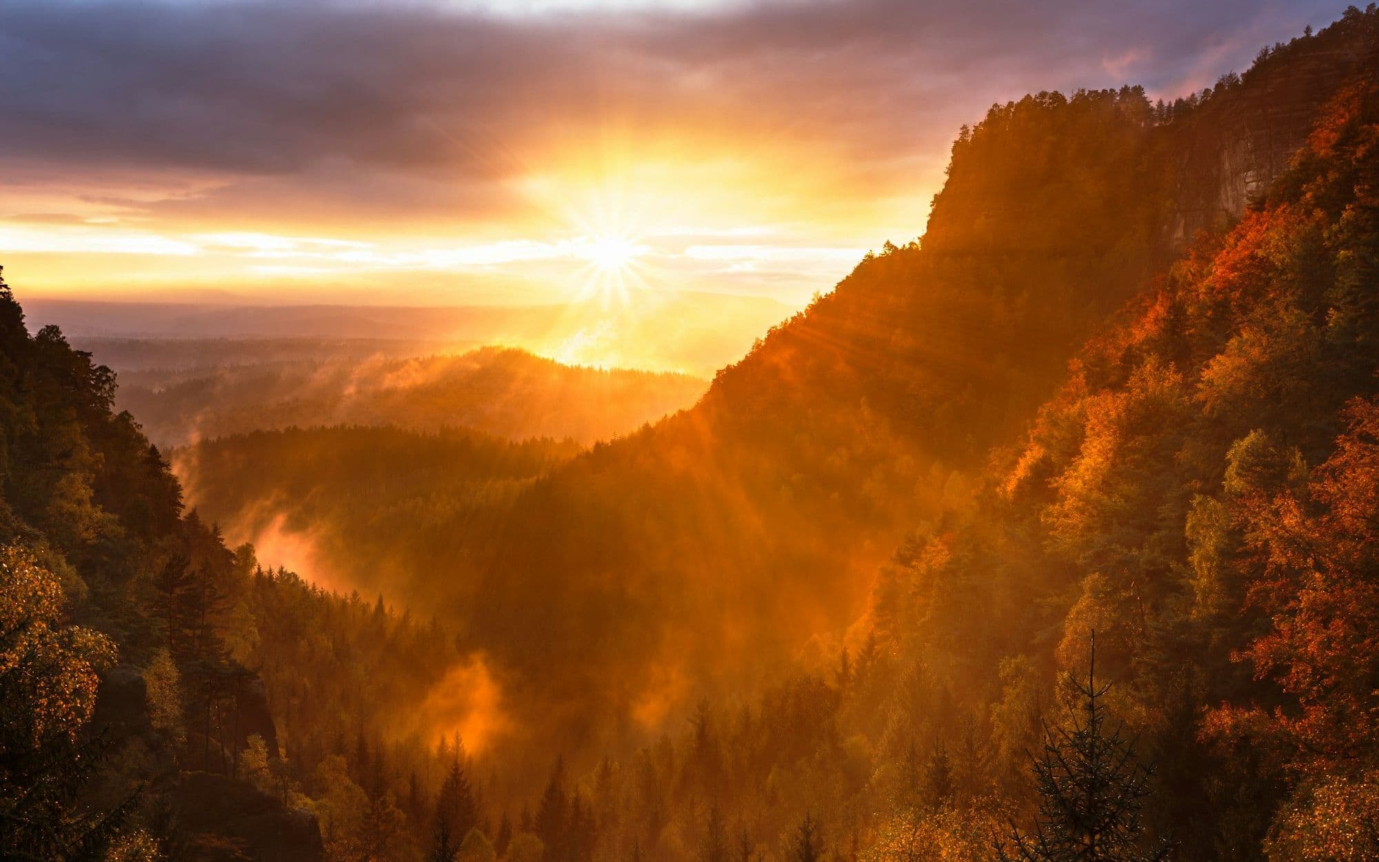 Golden light spilling over steep canyon walls