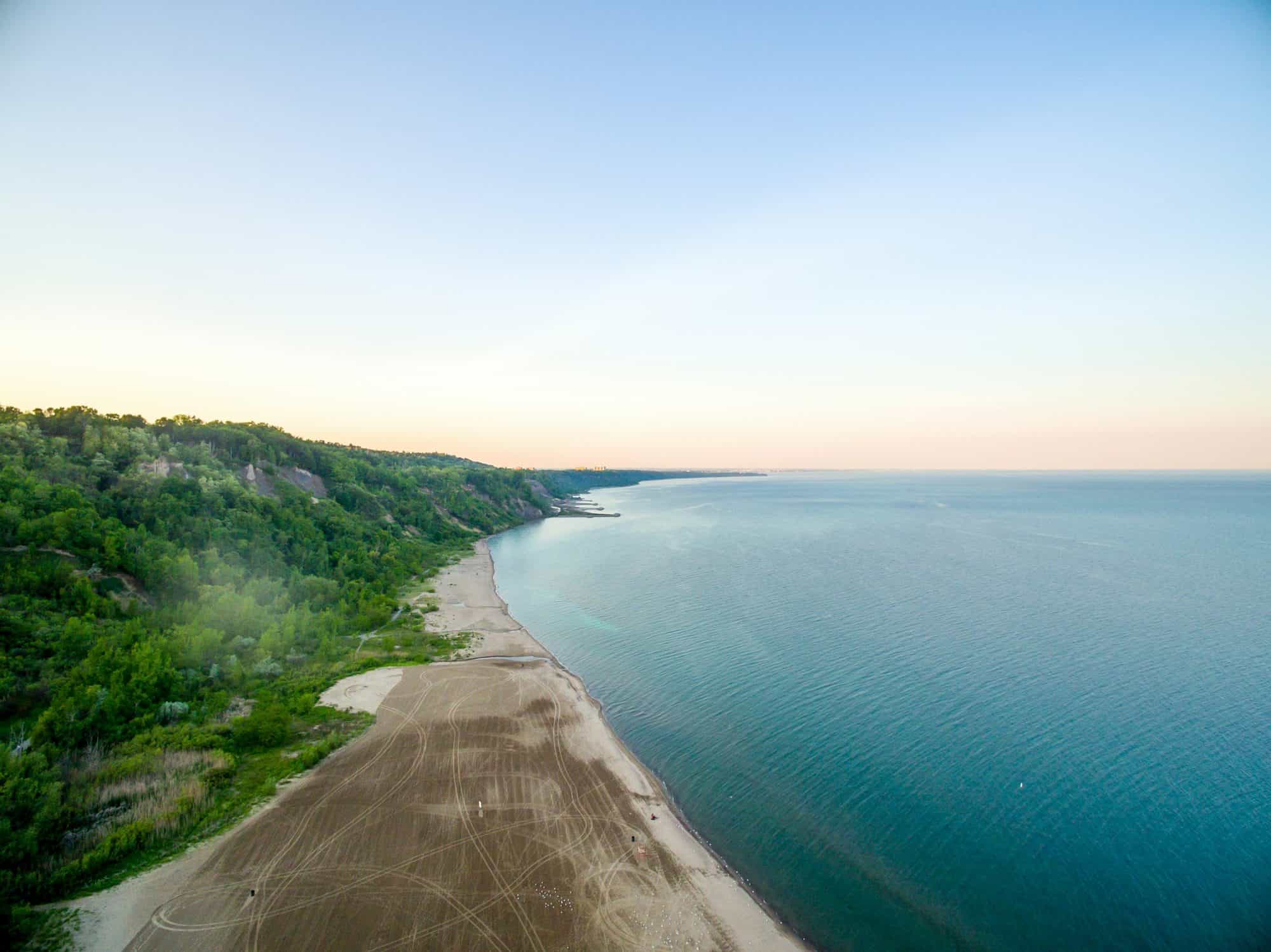 Aerial view of the Scarborough Bluffs and Lake Ontario shoreline at dawn