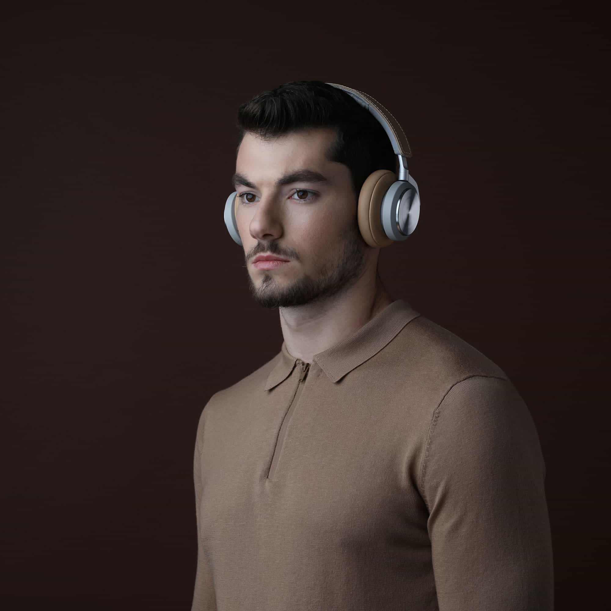 A person in headphones listening closely during an online session