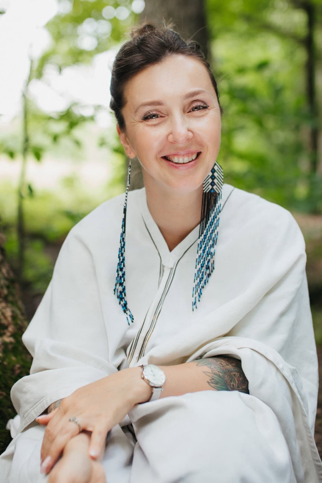 Mariya Garnet standing in forest light | Silver Owl Therapy
