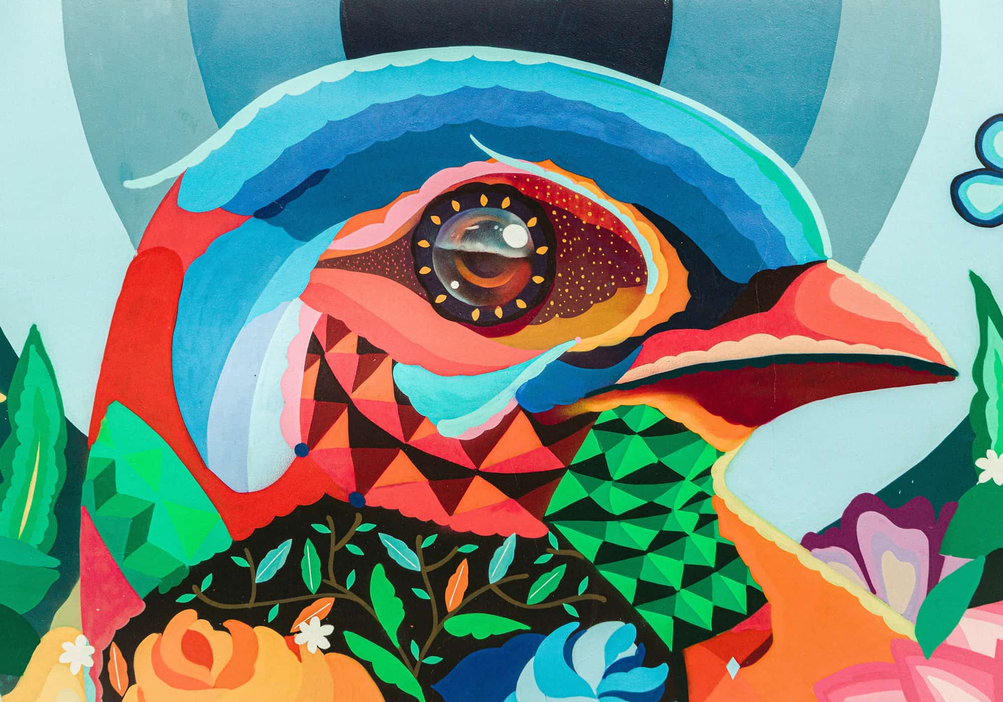 Colorful folk-art painting of a bird among floral and geometric patterns